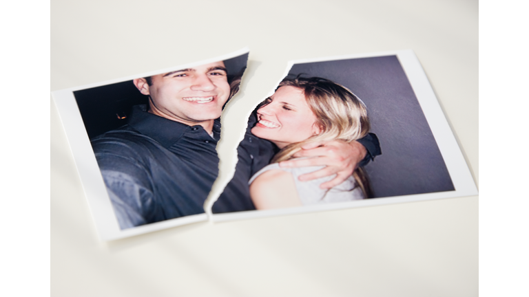 Photograph of couple ripped in half