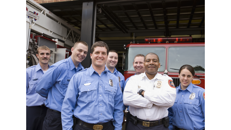 Portrait of Fire Fighters in Front of Fire Station