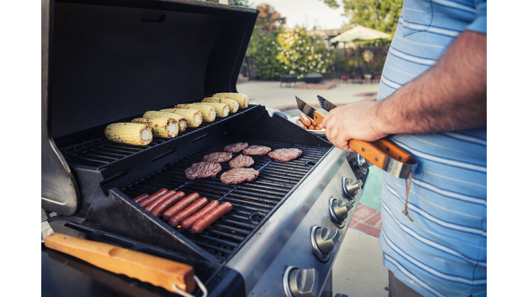 Close up of man grilling