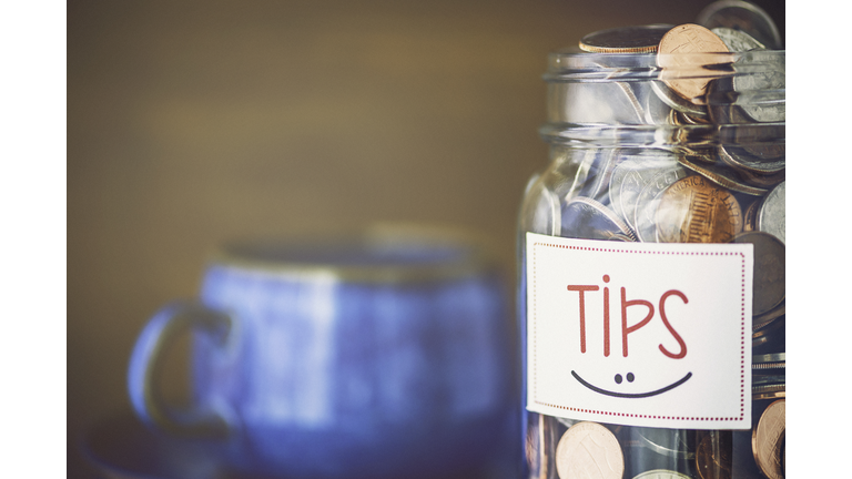 Tip jar in coffee shop or restaurant. American currency