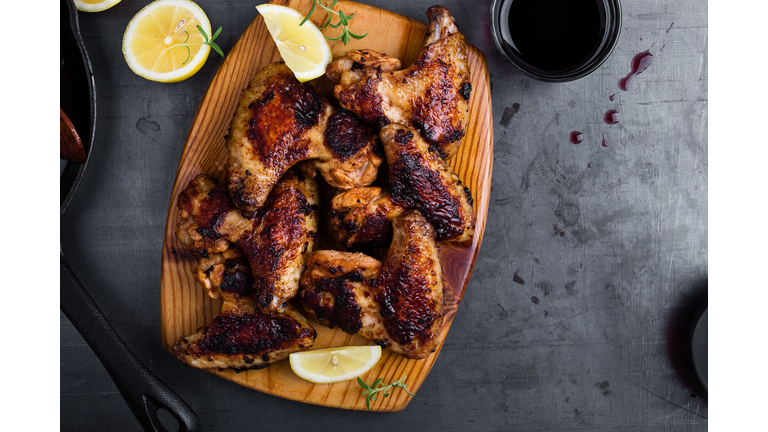 Roast chicken wings on cutting board