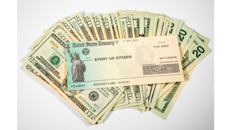 Illustration of the federal stimulus payment check from the IRS with cash on white