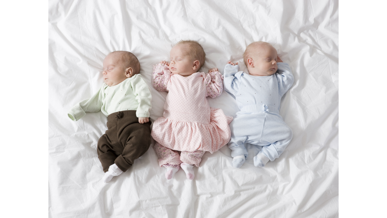newborn triplets asleep