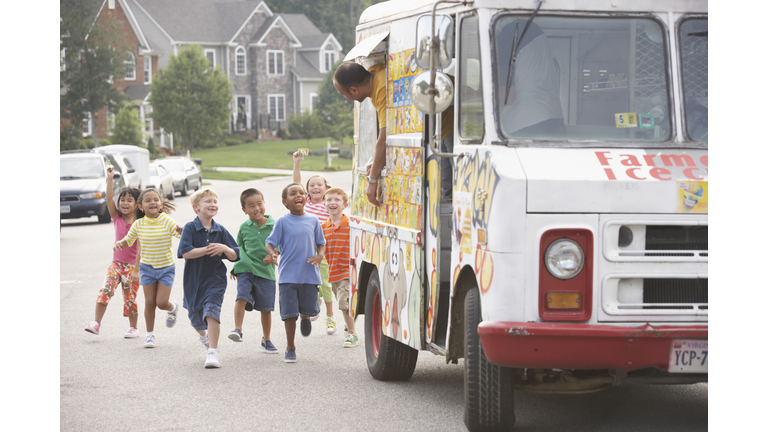 Children (4-8) running towards ice cream truck