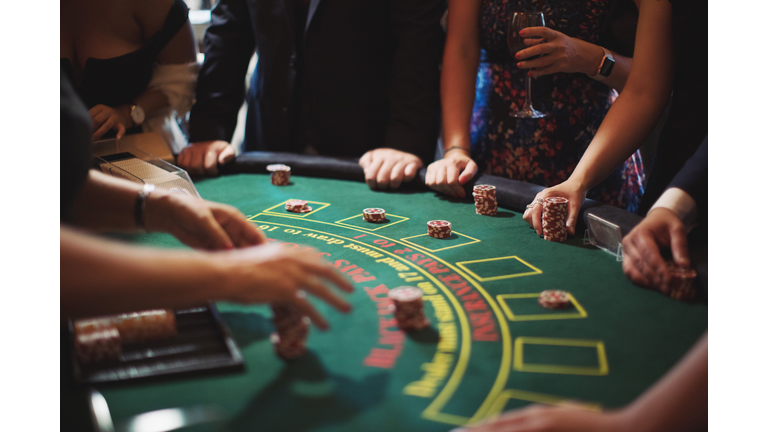 Cropped Image Of People Playing Poker