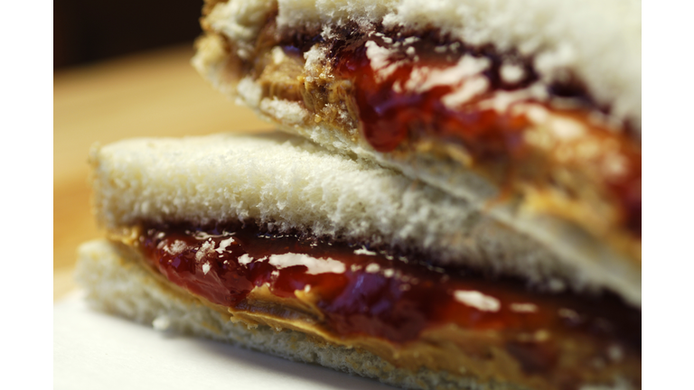 Close up of peanut butter and jelly sandwich on white bread