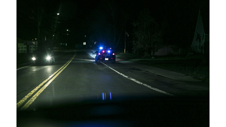 Roadside Car Pulled Over by Police at Night