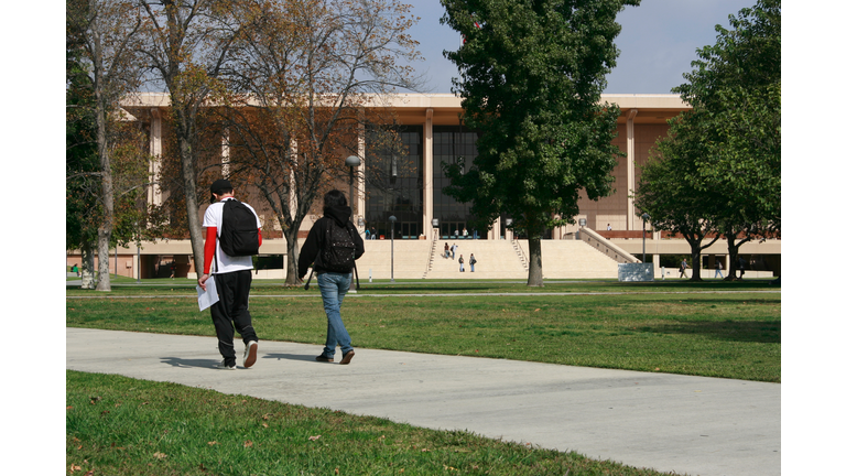 Class Walk two students male and female on college campus