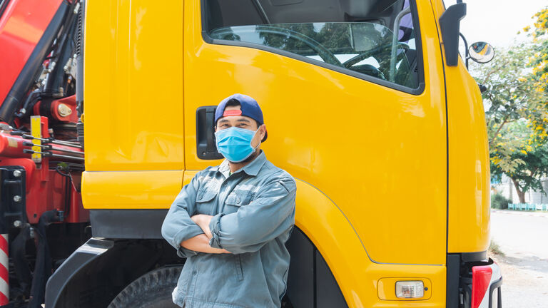Truck driver wearing a mask