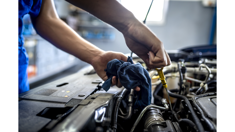 Checking oil in car engine