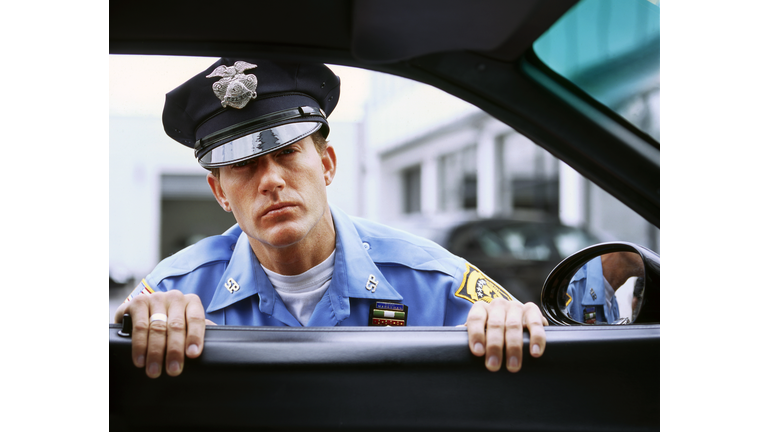 USA Policeman looking into car window