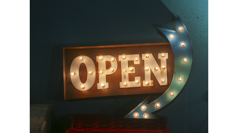 Electric bulb open sign with arrow