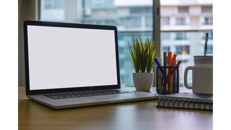Laptop and Office Supplies on Home Office Desk