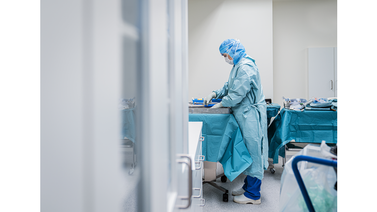 Female doctor in hospital preparing for surgery.