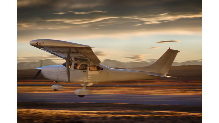 Single prop plane during liftoff from airport