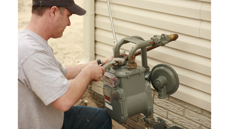 Plumber Repairing Water Pipe