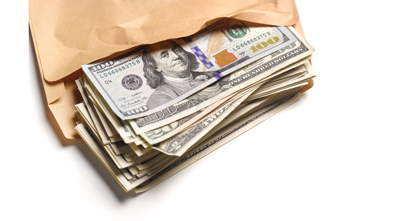 US Dollars in brown envelope