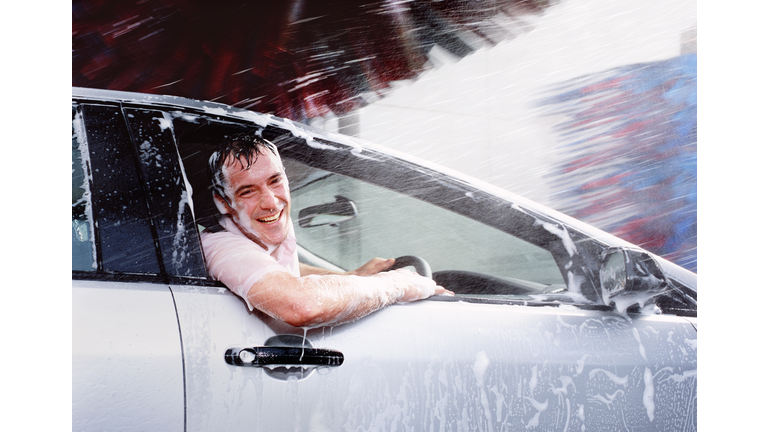 Man caught out in car wash with window open.