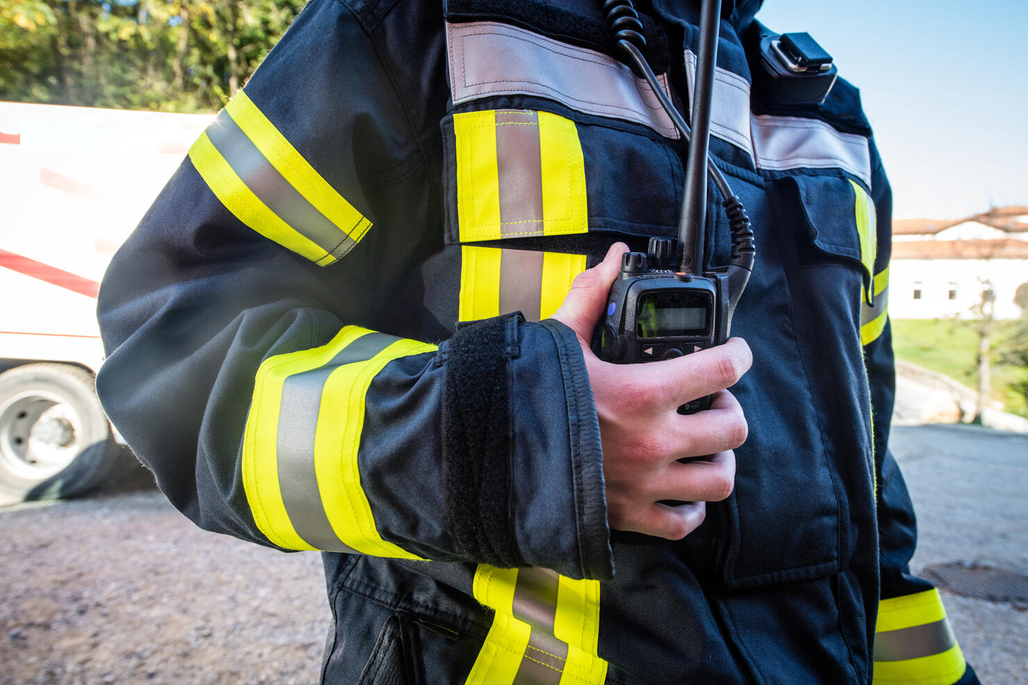 Firefighter using walkie talkie, rescue operation Close Up