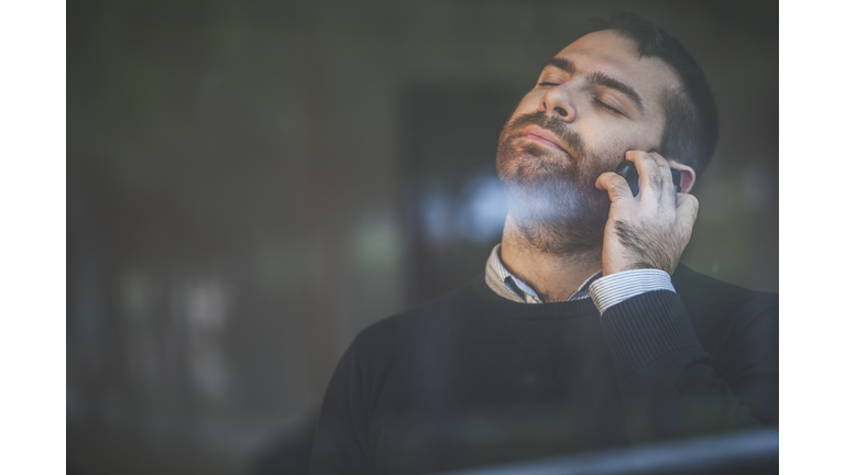 Worried man at the telephone: bad news