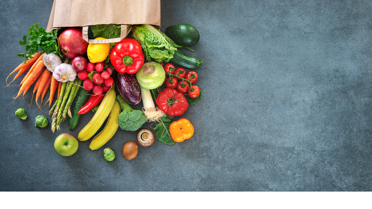 Shopping bag full of fresh vegetables and fruits