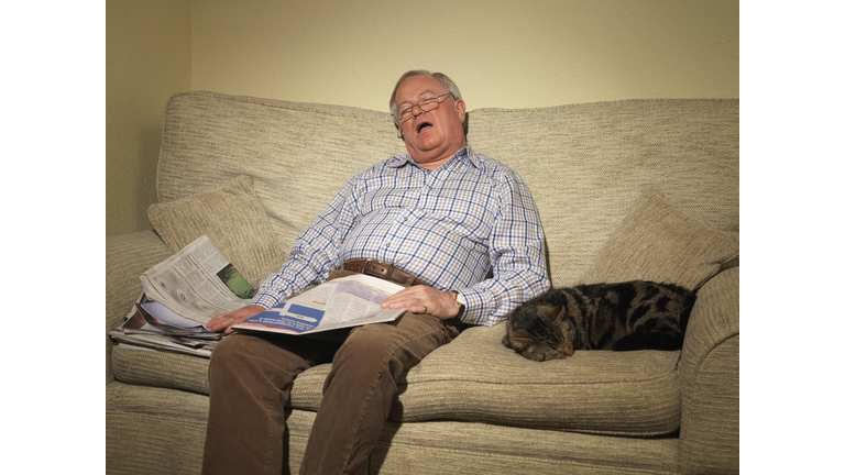 Senior Man Napping on Couch