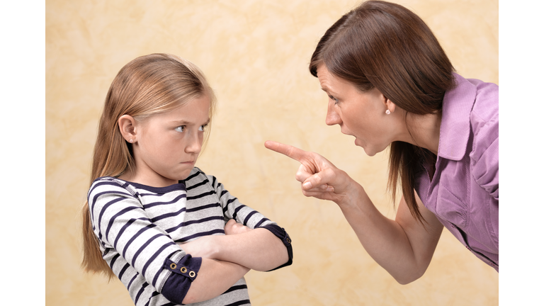 Daughter being told off by her mother