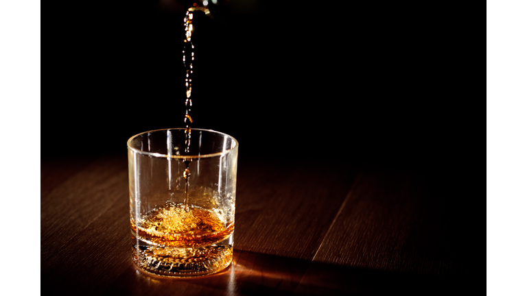 Whiskey being poured into a glass