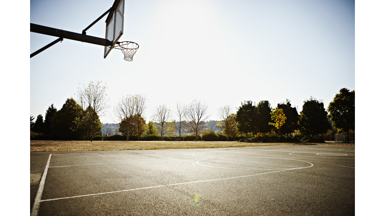 Empty outdoor blacktop basketball court