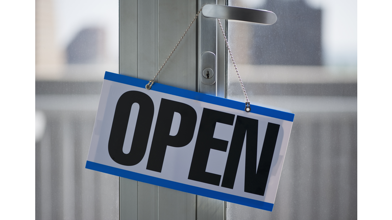 Open sign hanging on door