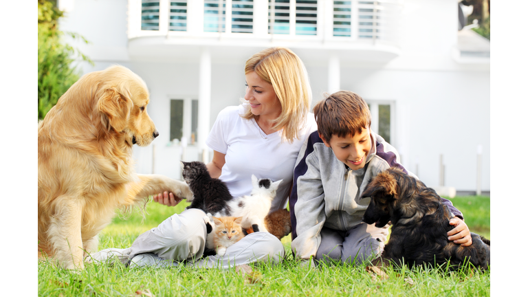 Mother, son and pets.