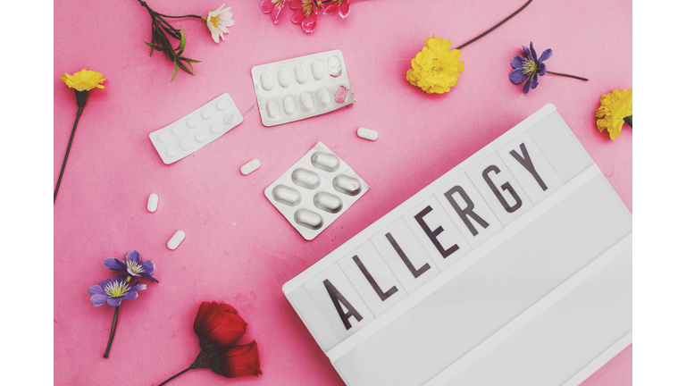 allergy text in lightbox with pills and flowers