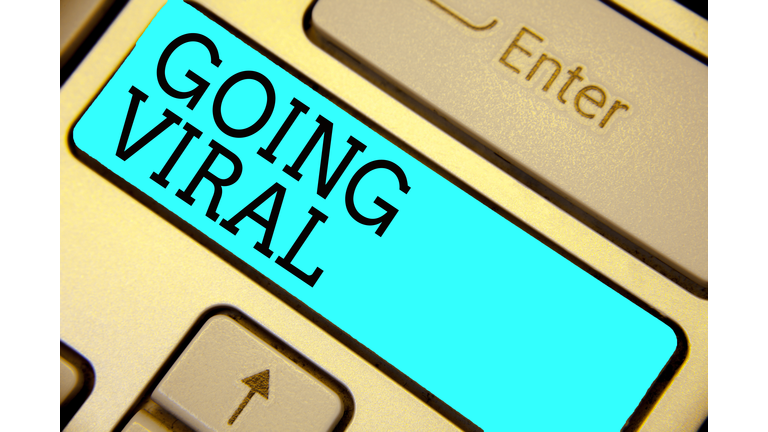 Handwriting text Going Viral. Concept meaning image video or link that spreads rapidly through population Keyboard blue key Intention create computer computing reflection document