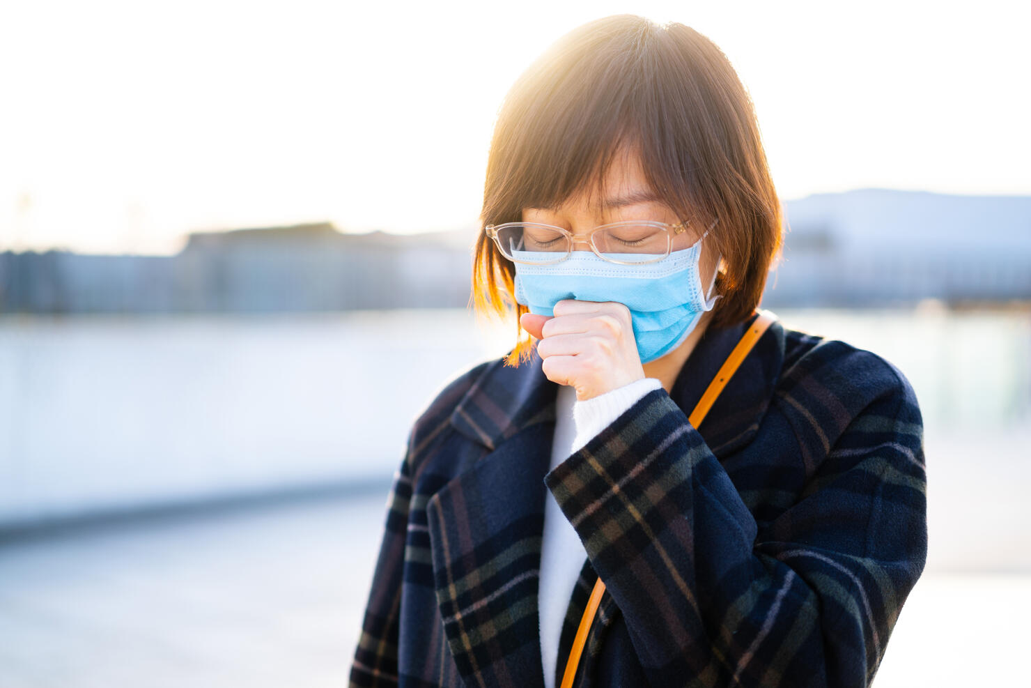 female cough with using mobile phone