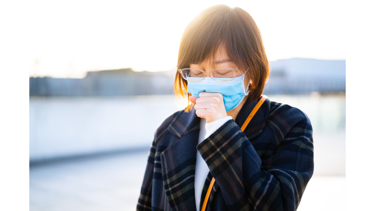 female cough with using mobile phone