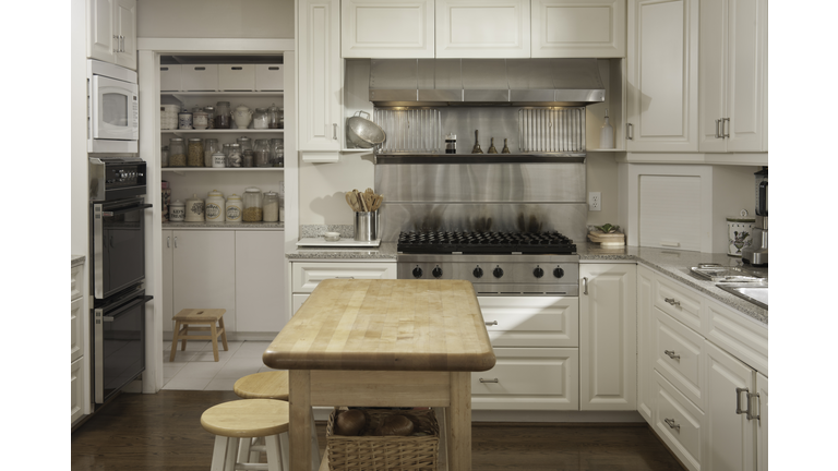 Wooden counter and stove in modern kitchen