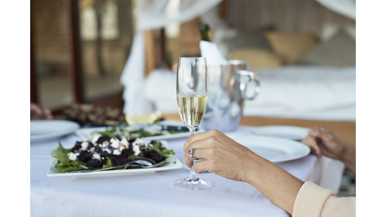 Couple having private romantic dinner in luxury cabin