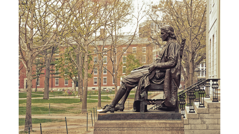 A profile view of the John Harvard Statue in Cambridge Ma