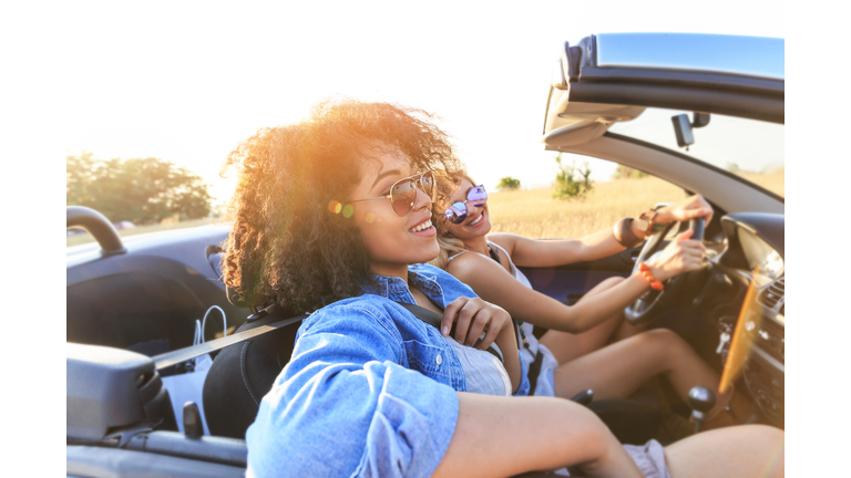 Girlfriends having fun on road trip