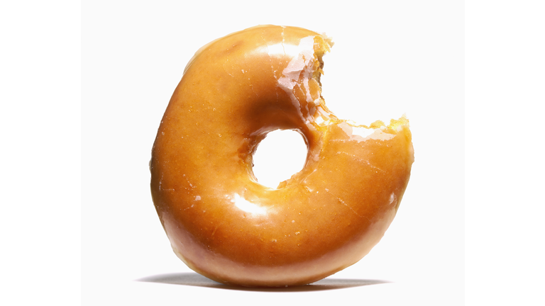 Glazed doughnut with missing bite