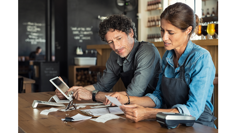 Staff calculating restaurant bill