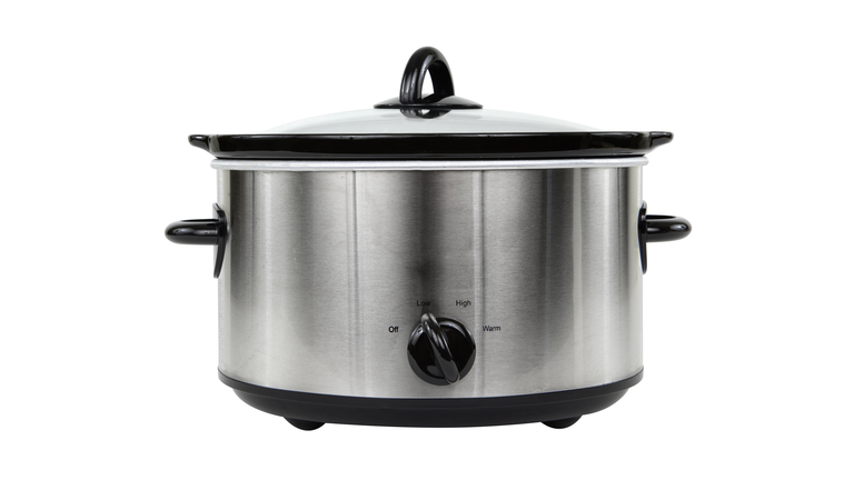 Photograph of silver crockpot isolated on white background