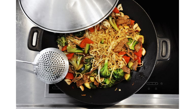 Cooking vegetable stir-fry in a wok