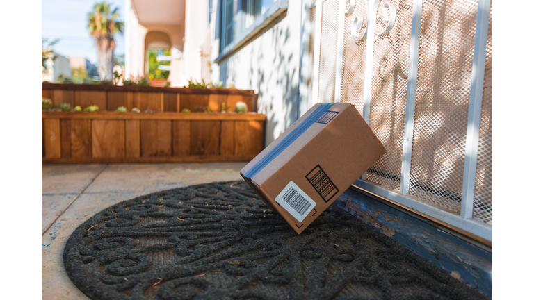 Cardboard package delivery at front door