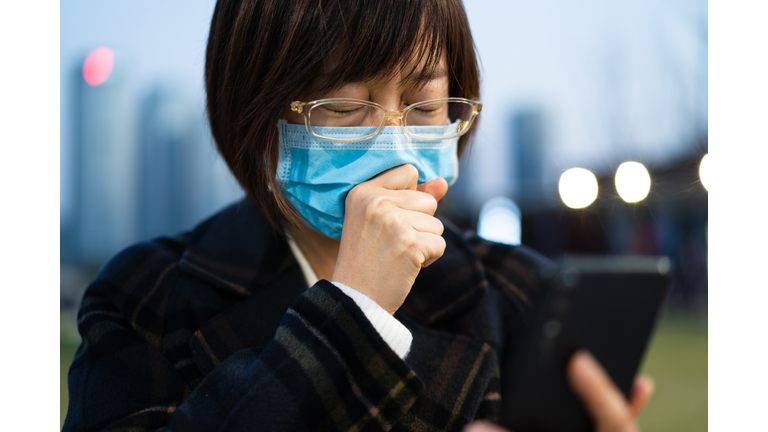 female cough with using mobile phone