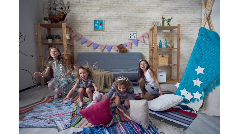 Expressive kids having fun in playroom