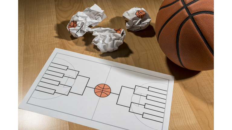 Trying to fill out college basketball tournament bracket on paper