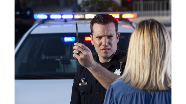 Police officer conducting sobriety test