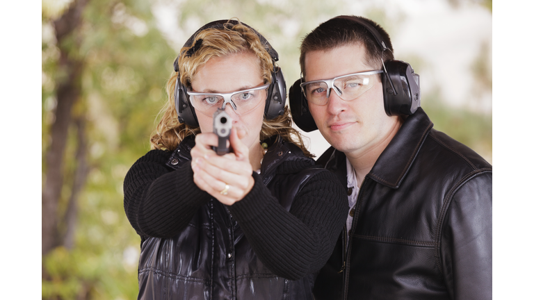 Man and Woman at the Shooting Range