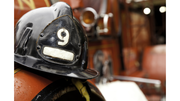 Firefighter Helmet Resting on Firetruck
